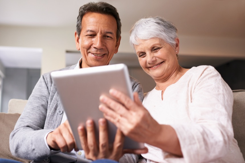 a clinician showing a patient something on a tablet